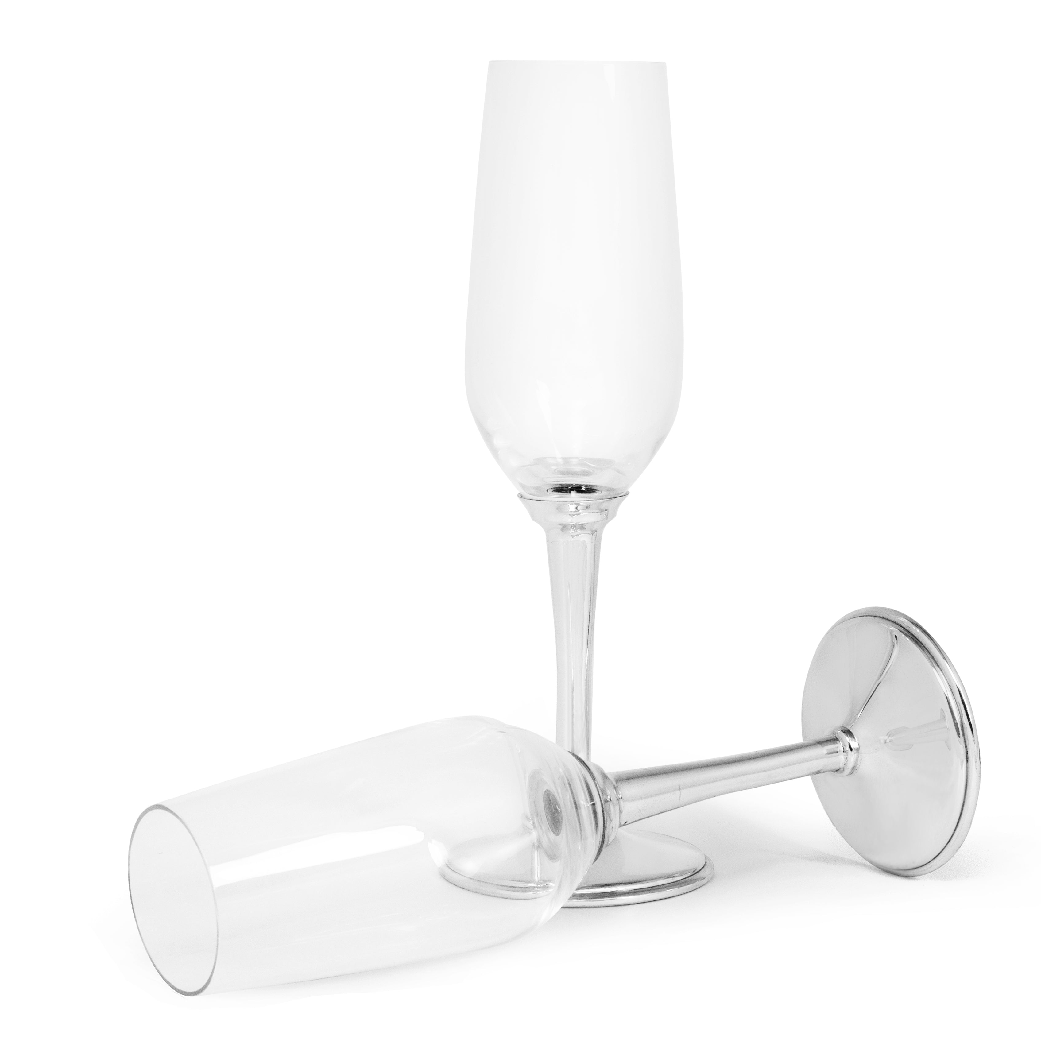 Two clear champagne flutes with silver bases on a white background