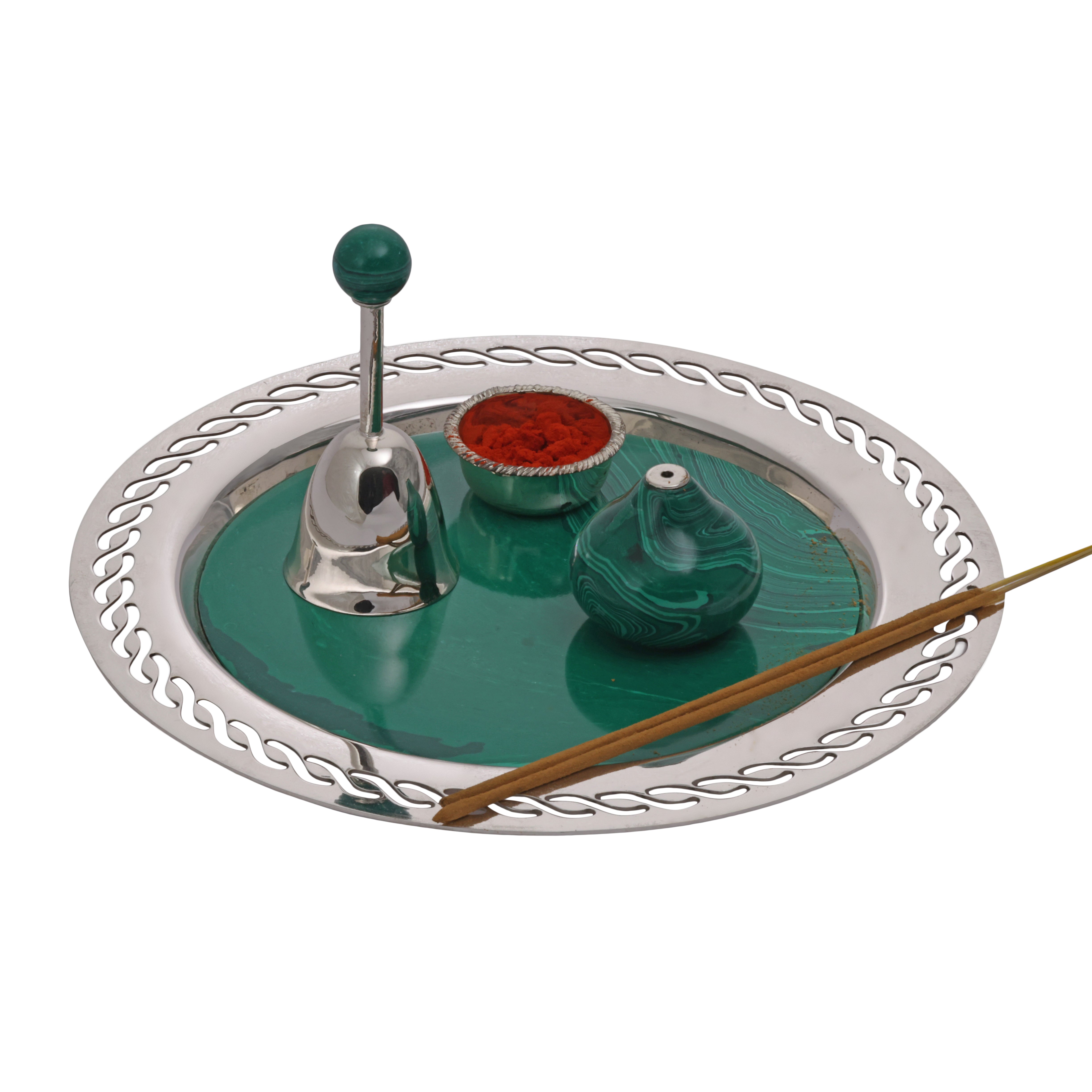 Decorative incense holder with a bell, candles, and sticks on a white background
