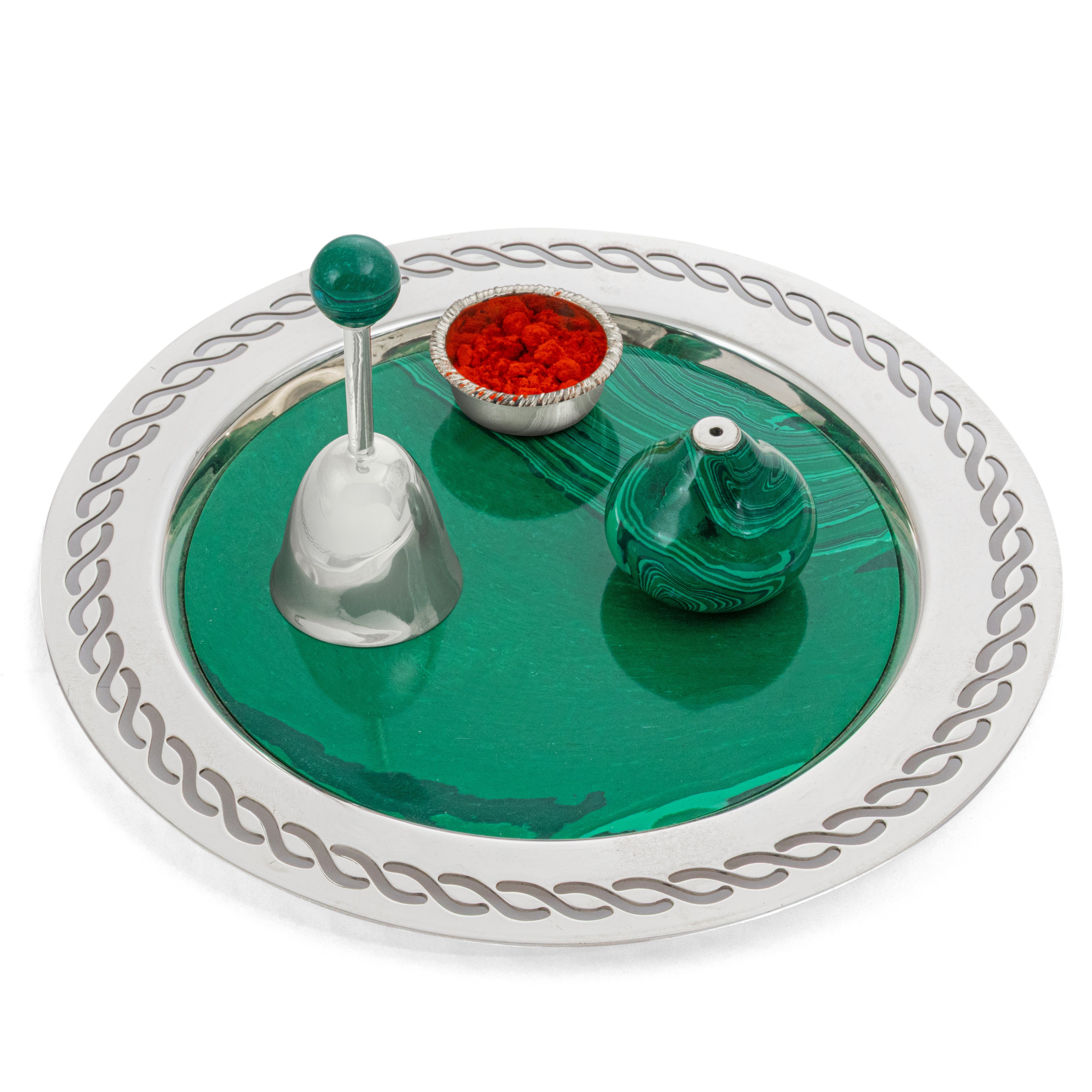 Decorative item with green, red, and silver elements on a white background